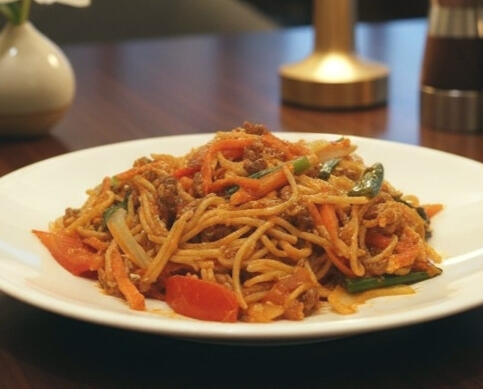 Shanghai spaghetti made from a family recipe with beef mince, onions, carrots, egg and spring onions in a savoury tomato sauce.